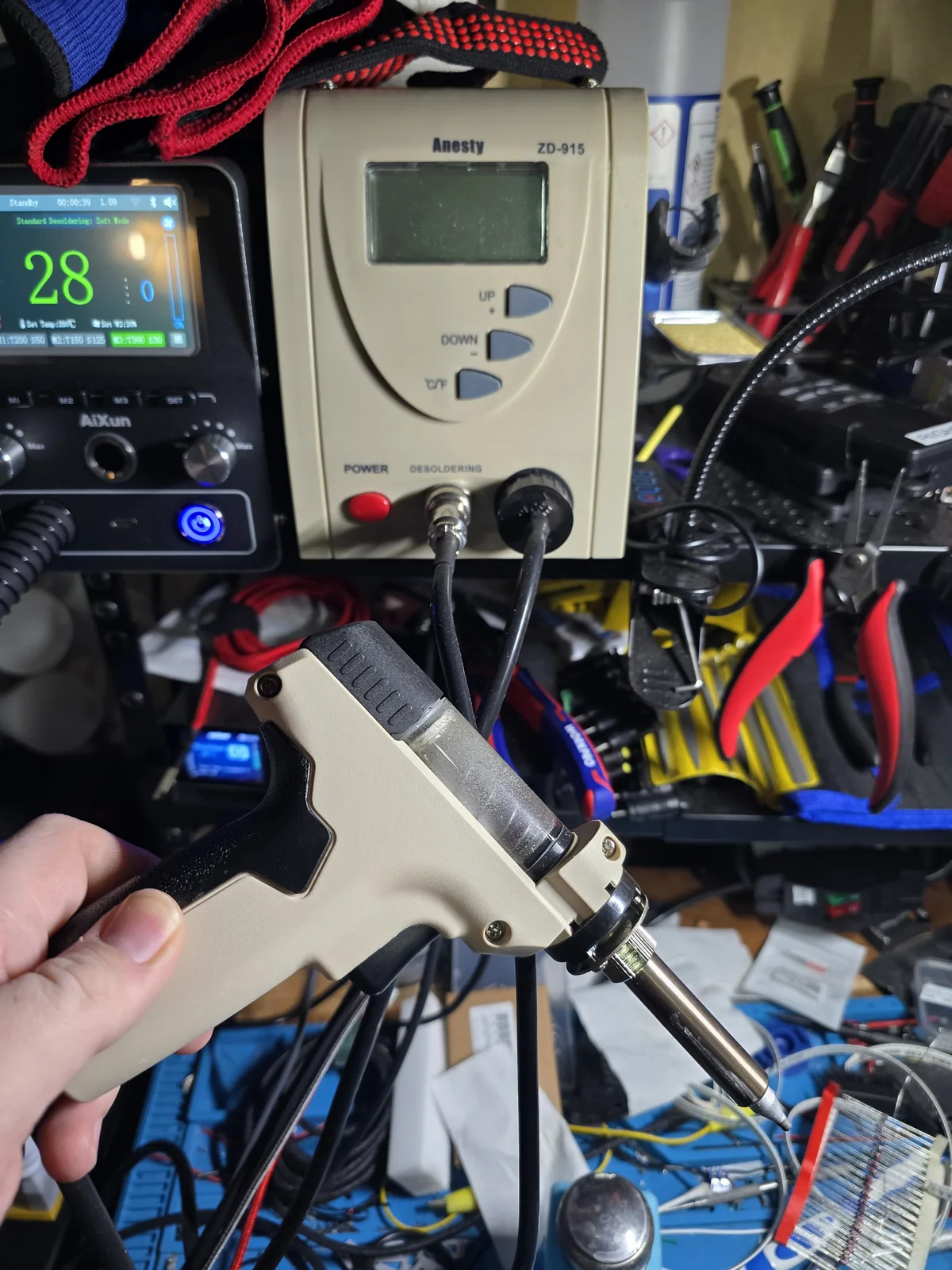 An Anesty ZD-915 desoldering station with a vacuum handpiece, temperature display and power switch.