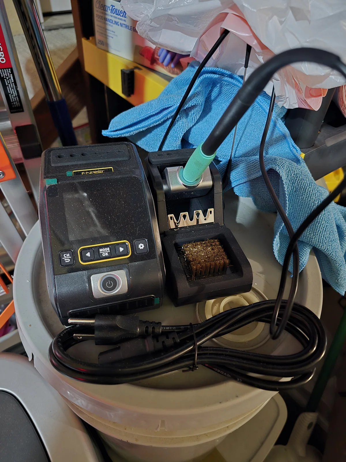 A FNIRSI DWS-200 soldering station on the workbench.