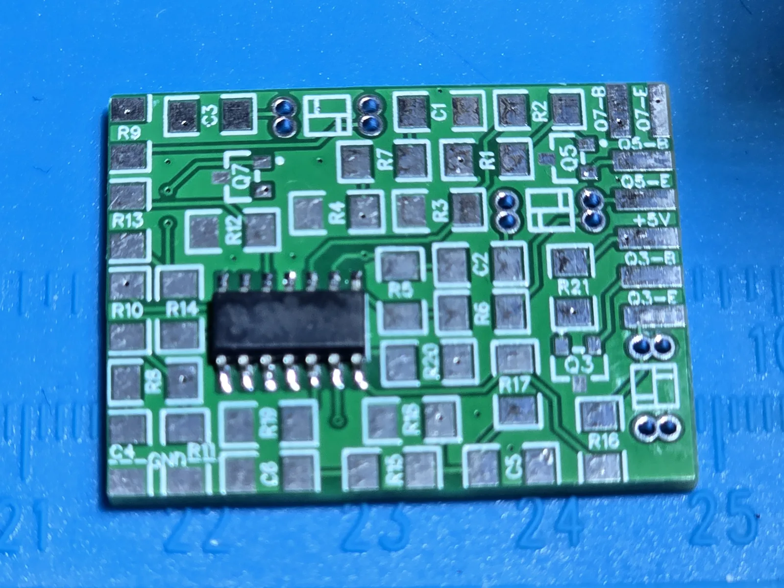 The bare mod board with only the op-amp fitted, cleaned, showing all fourteen individual solder fillets and the empty resistor and capacitor pads.