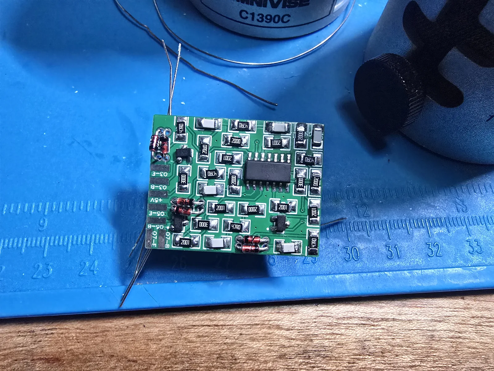 The mod board with three pairs of axial 1N4148 diodes inserted through their holes, leads protruding, ready to solder.