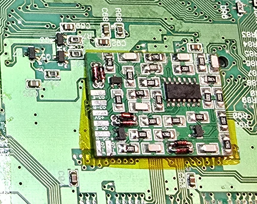 Wider view of the SNES motherboard showing the three stock RGB transistors in context near the video encoder.