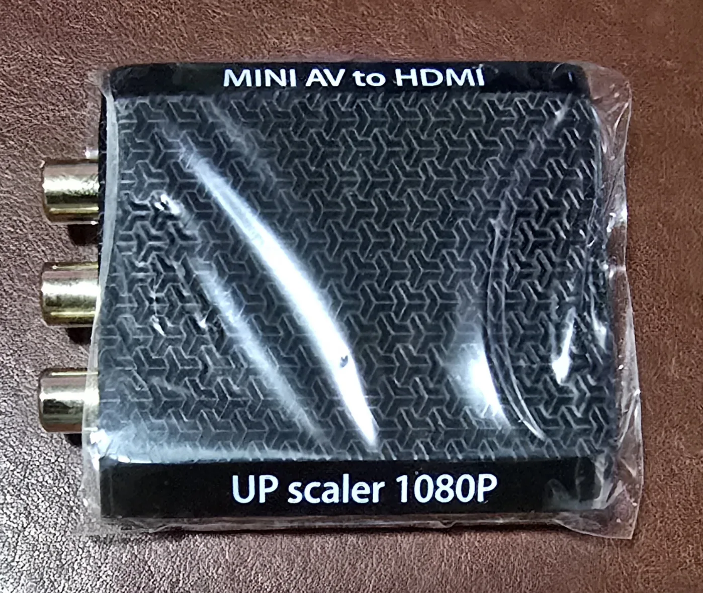 Top of the mini composite AV-to-HDMI converter, labeled MINI AV to HDMI UP scaler 1080P