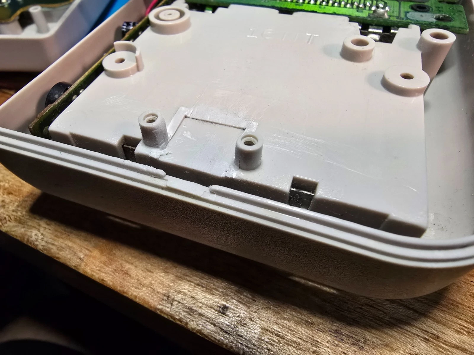 The DMG shell after trimming the internal plastic so the slightly larger new jack fits, the cut is hidden inside the console