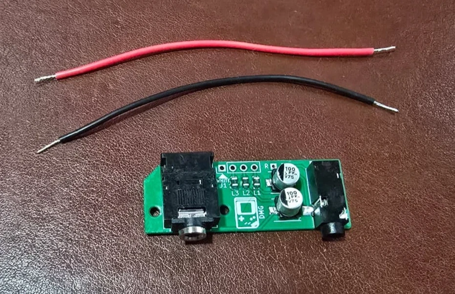 Pro line-out board with the two included pre-stripped connection wires, one red and one black