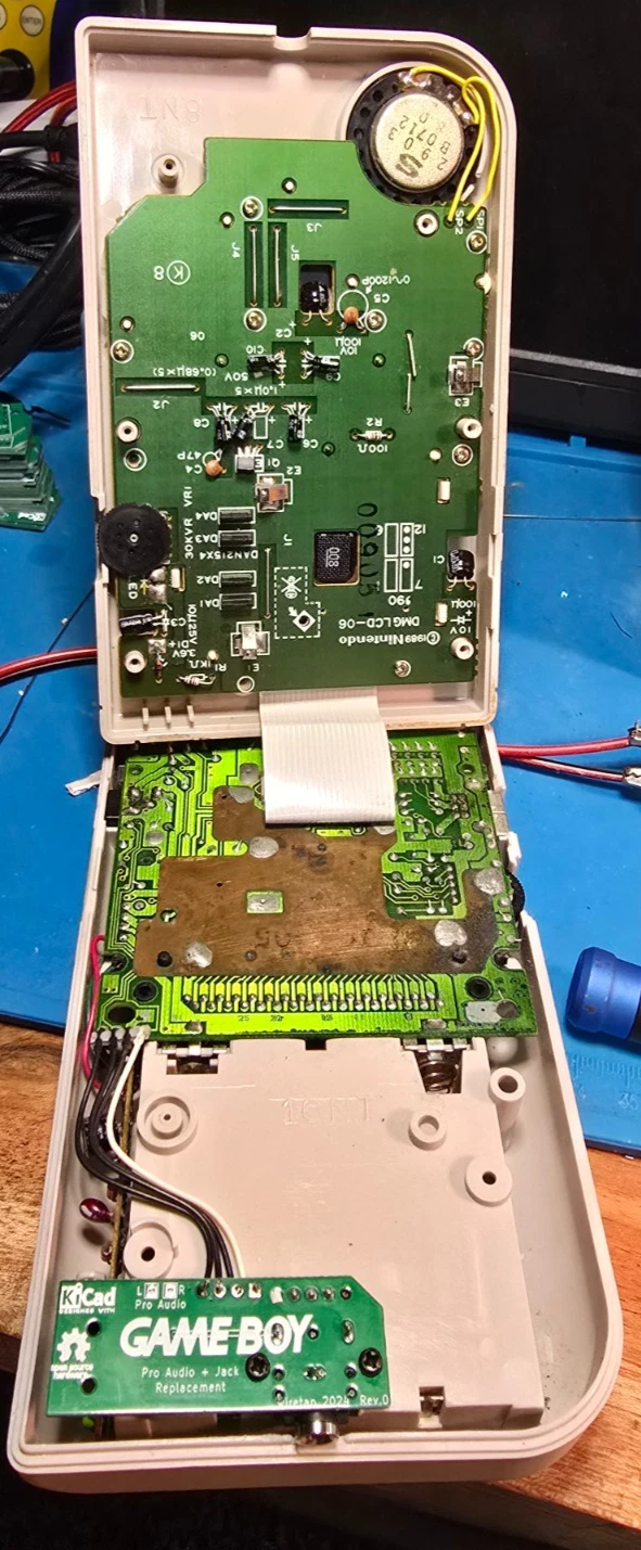The CA-DMG-HPJ replacement headphone board installed inside this opened Game Boy