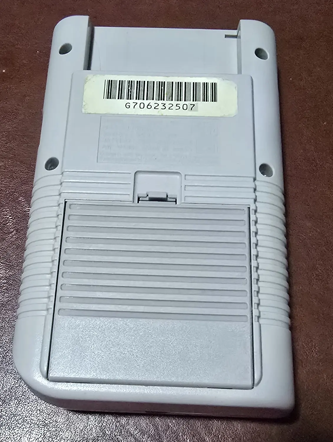Back of the first Game Boy showing the serial label reading G706232507