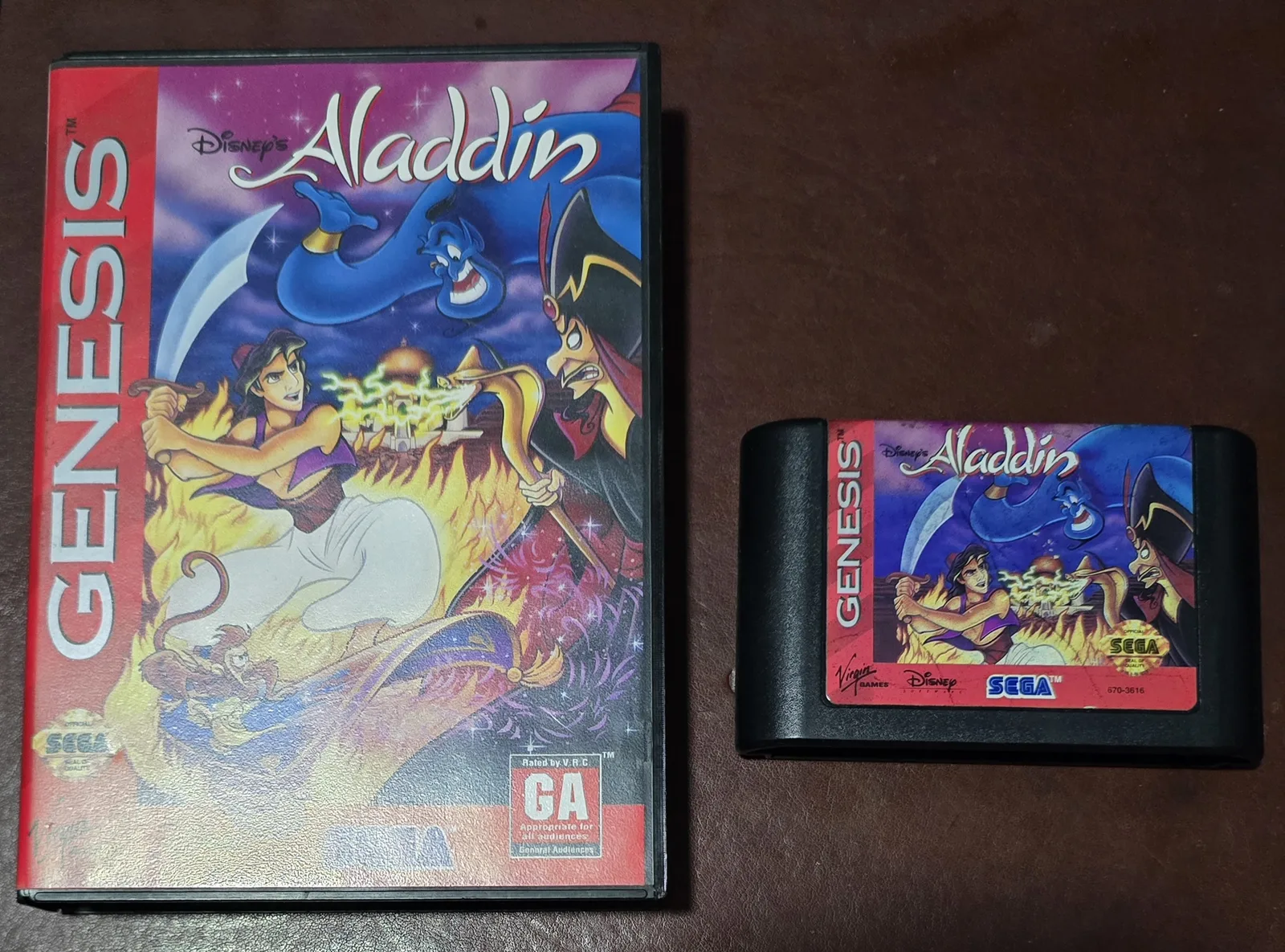 Hero shot of the complete-in-box Disney's Aladdin for Sega Genesis - the vibrant box and the cartridge side by side