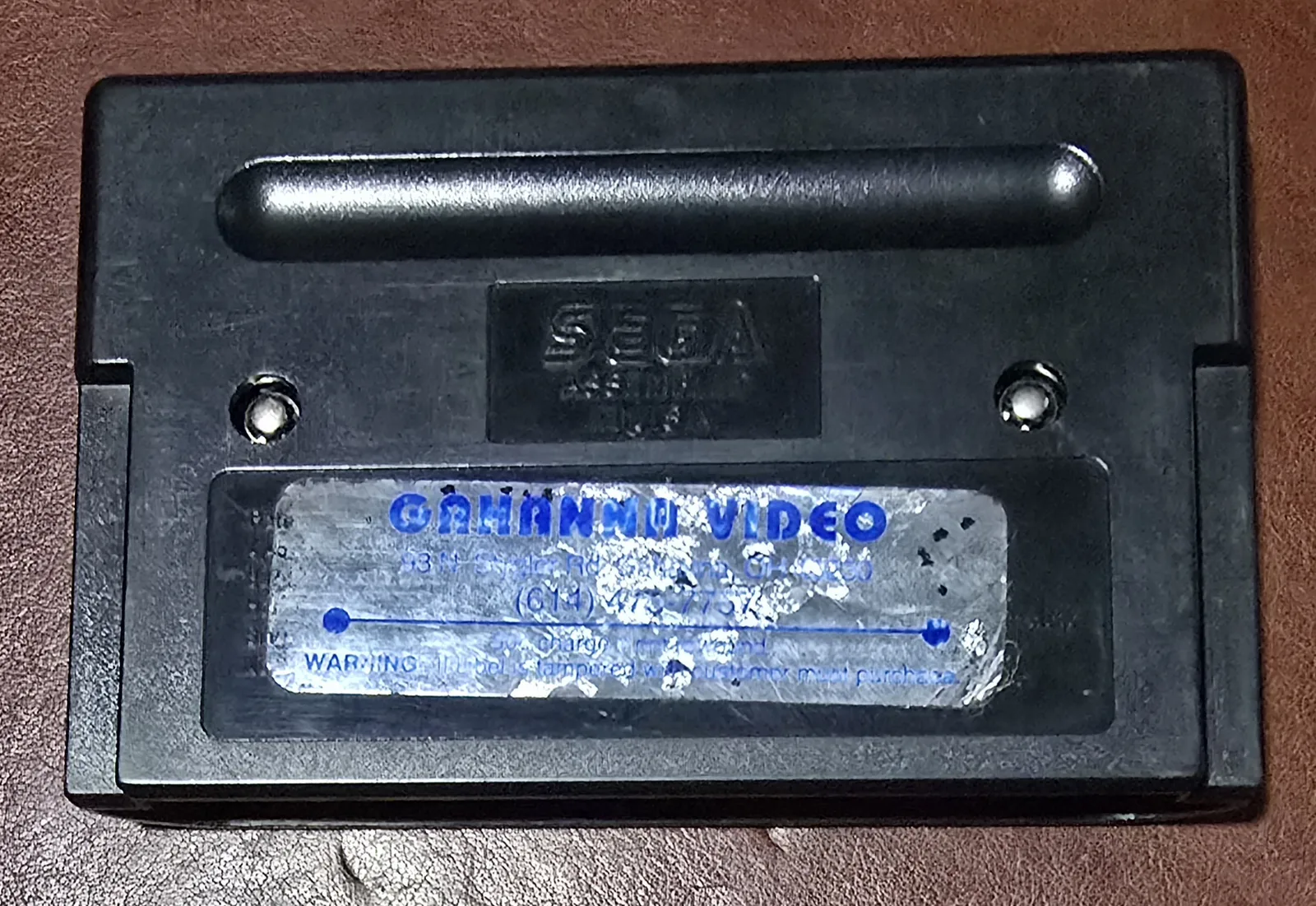 Back of the cartridge showing the original Gahanna Video rental-store sticker, left on for authenticity