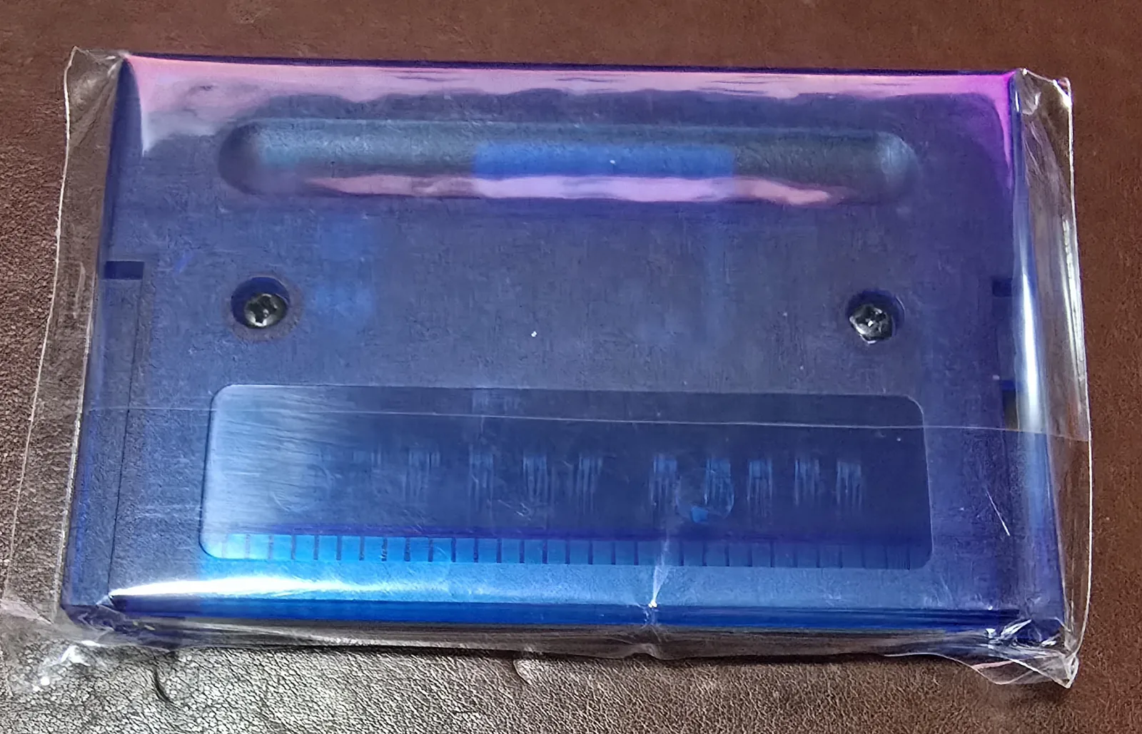 Back of the translucent blue Genesis flash cartridge shell