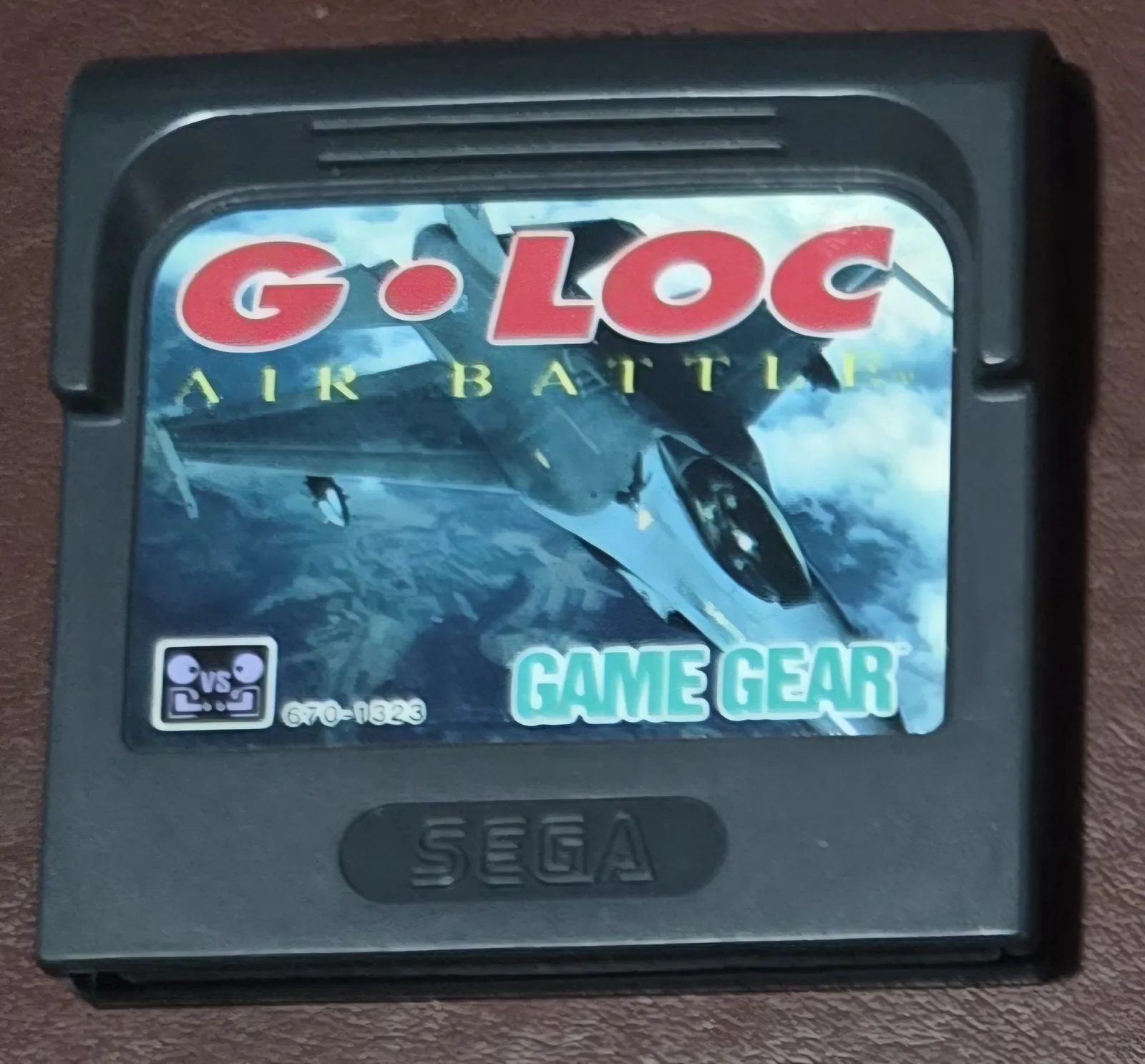 Front of an authentic Sega Game Gear G-LOC Air Battle cartridge, jet-fighter label