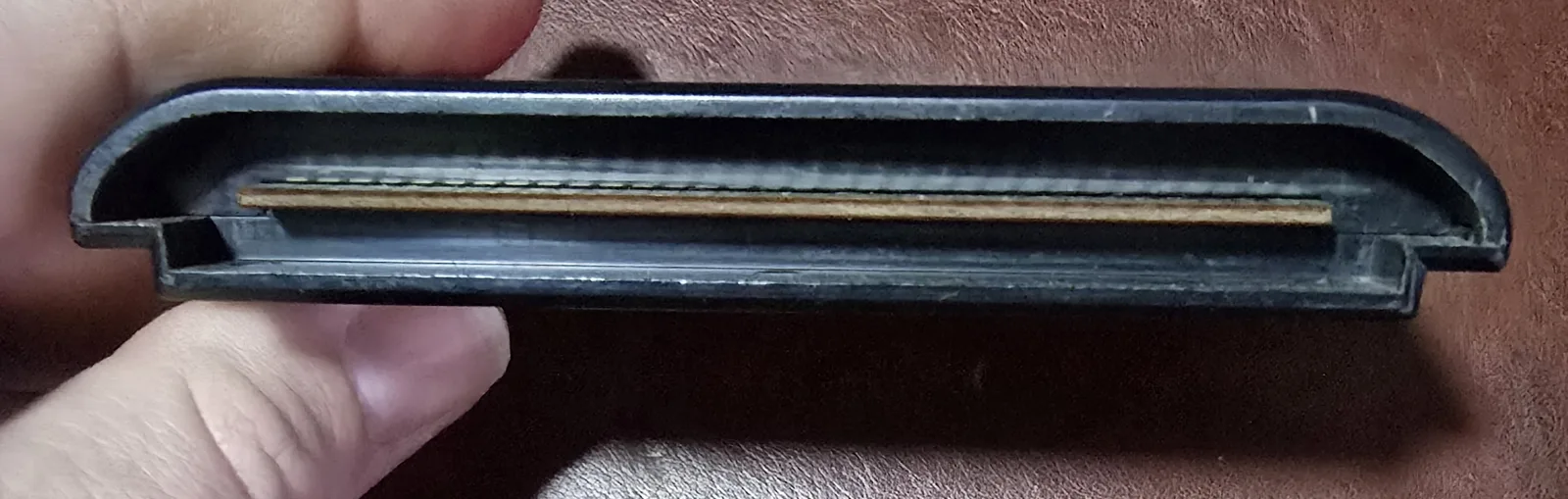 Edge connector of the Genesis cartridge showing the cleaned gold contacts