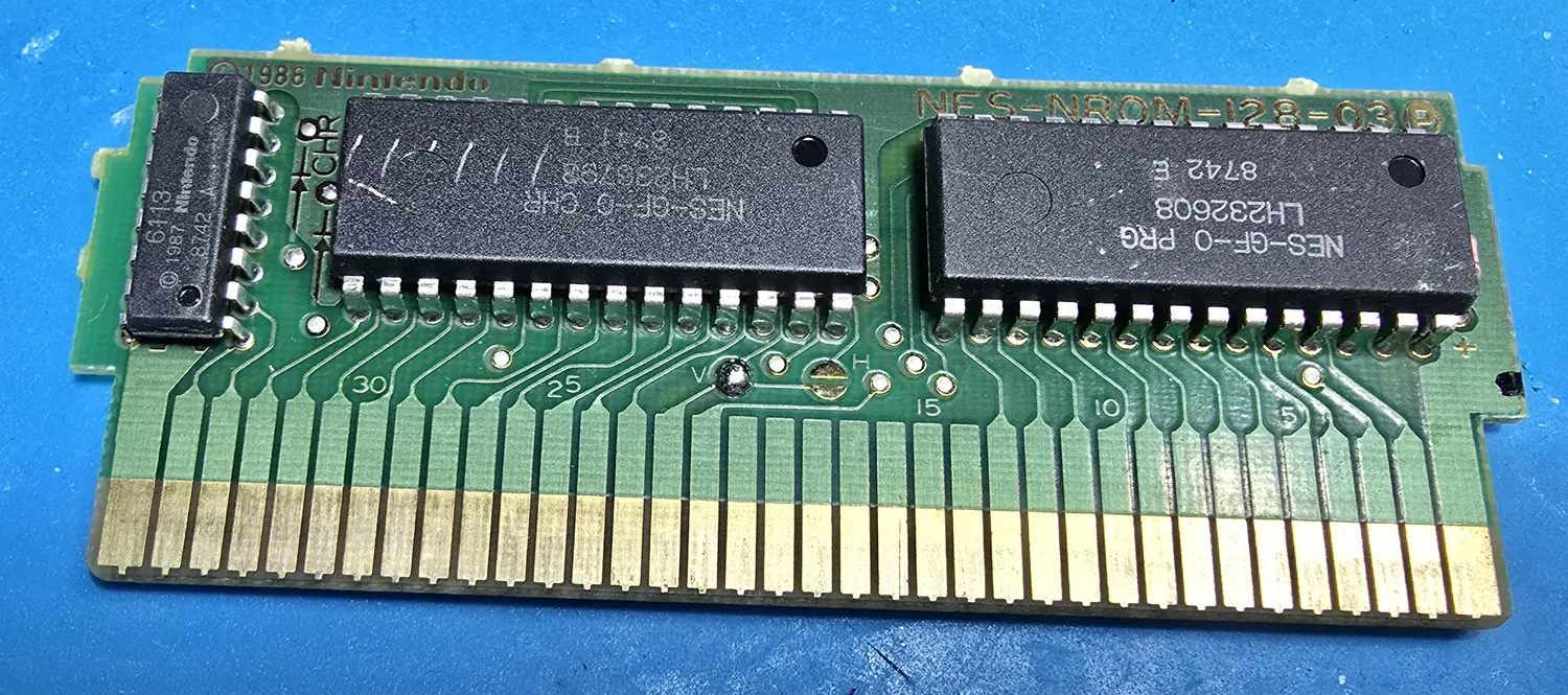 Component side of the Golf cartridge board, an NES-NROM-128-03 with the CIC chip and both mask ROMs visible