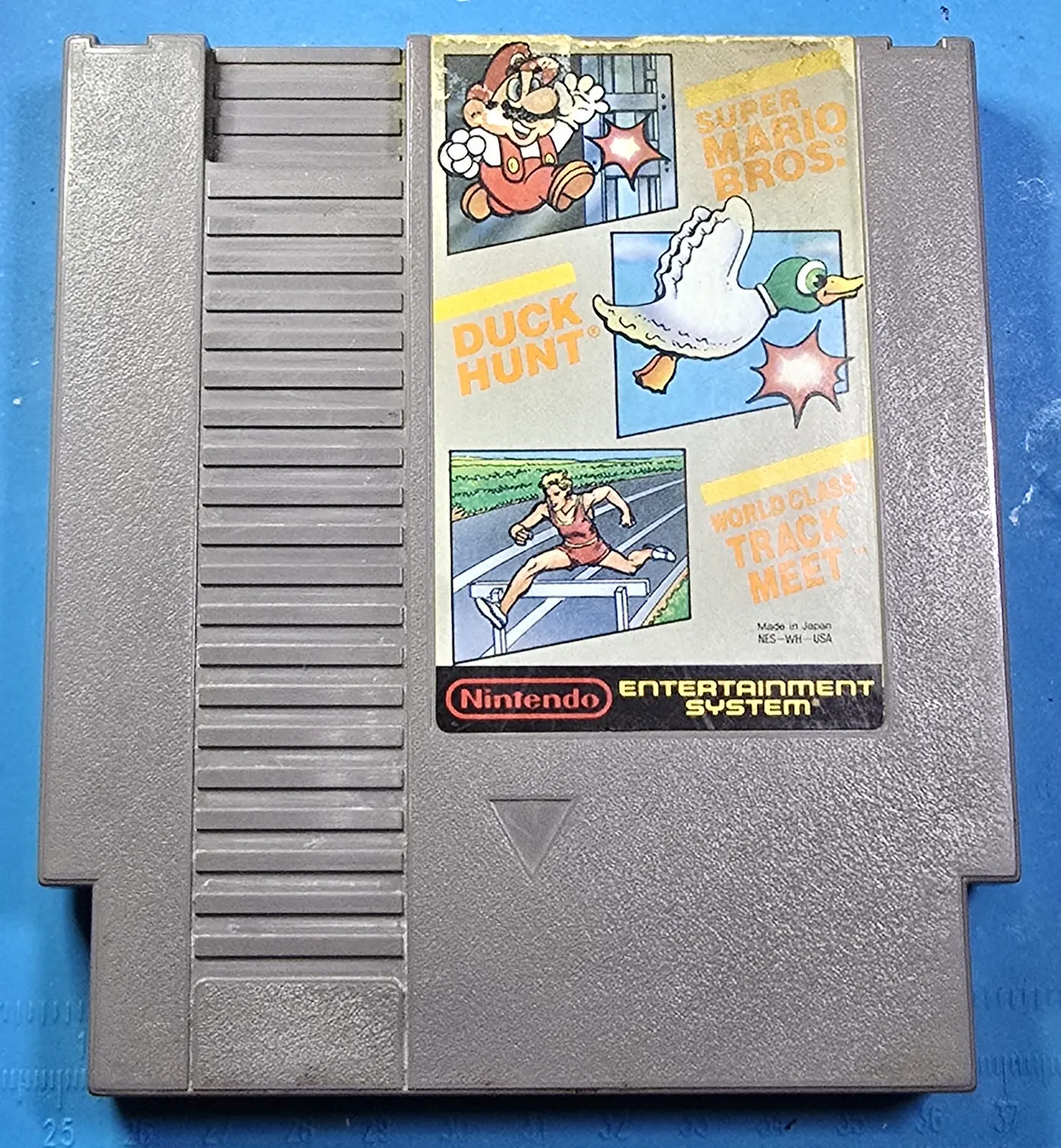 Front of an authentic Nintendo Super Mario Bros. slash Duck Hunt slash World Class Track Meet NES cartridge, label NES-WH-USA