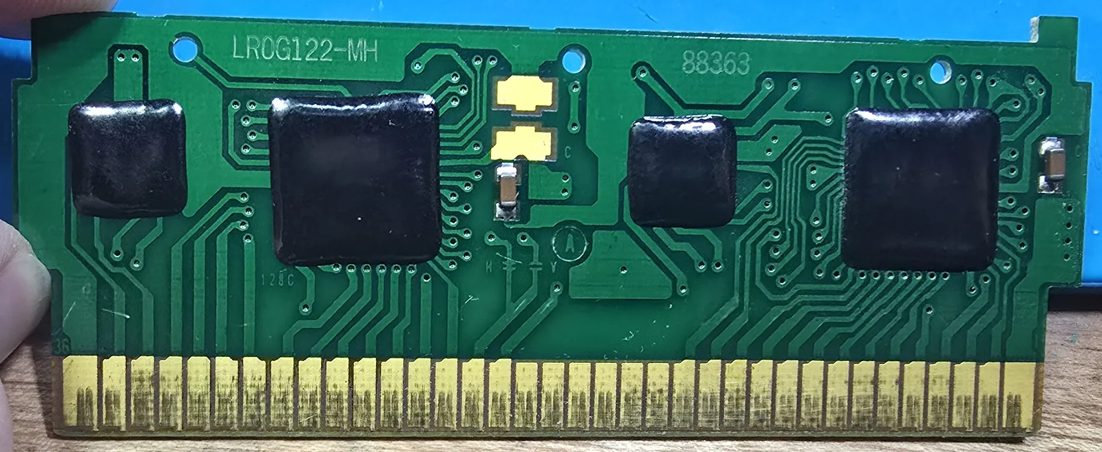 Genuine Nintendo Super Mario Bros. slash Duck Hunt circuit board with its four chips sealed under black epoxy blobs