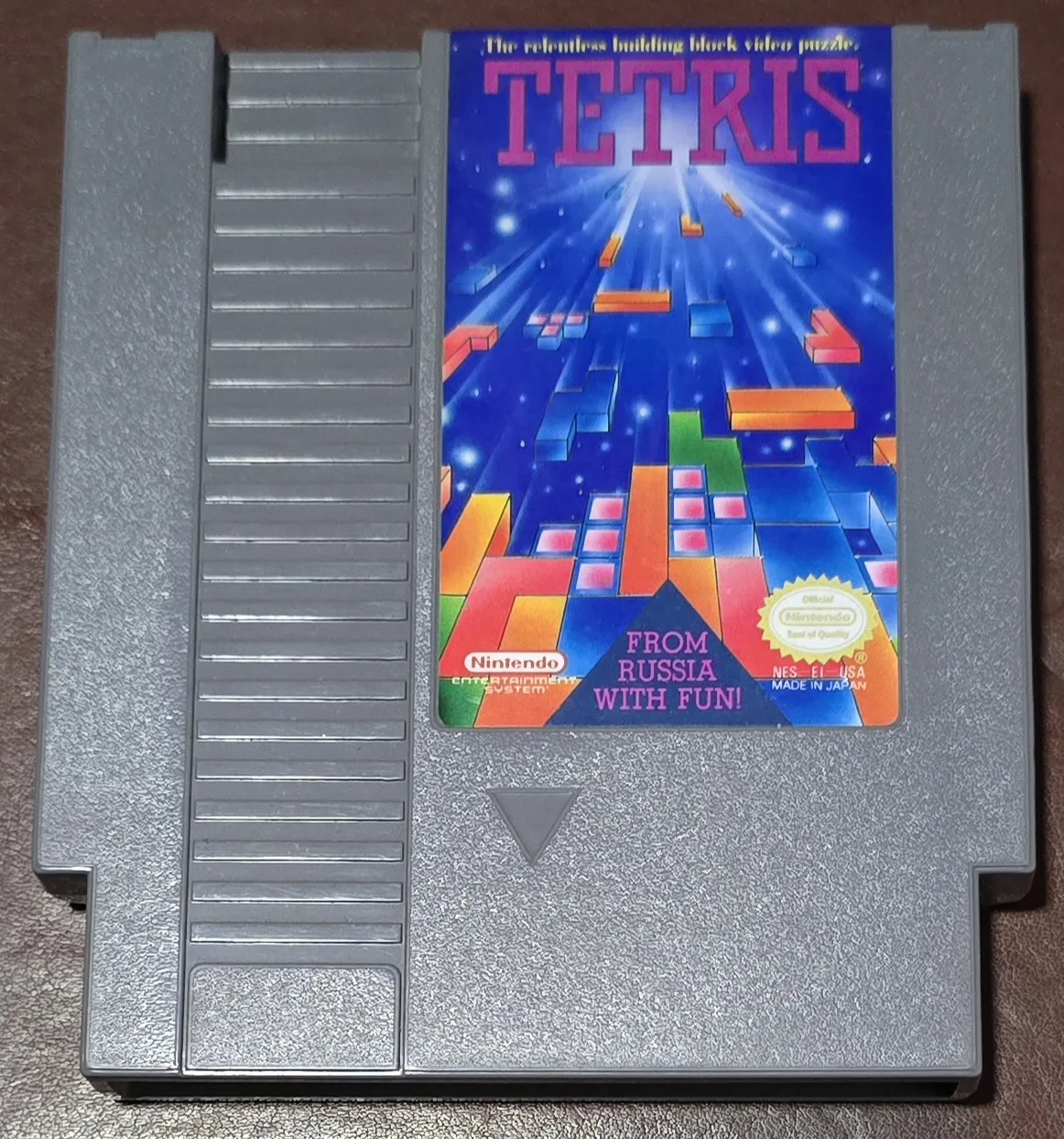 Front of an authentic Nintendo Tetris cartridge for the NES, the 'From Russia with Fun!' label with the official Nintendo Seal of Quality