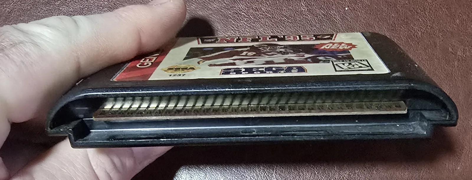 Edge connector of the Genesis cartridge showing the cleaned gold contacts
