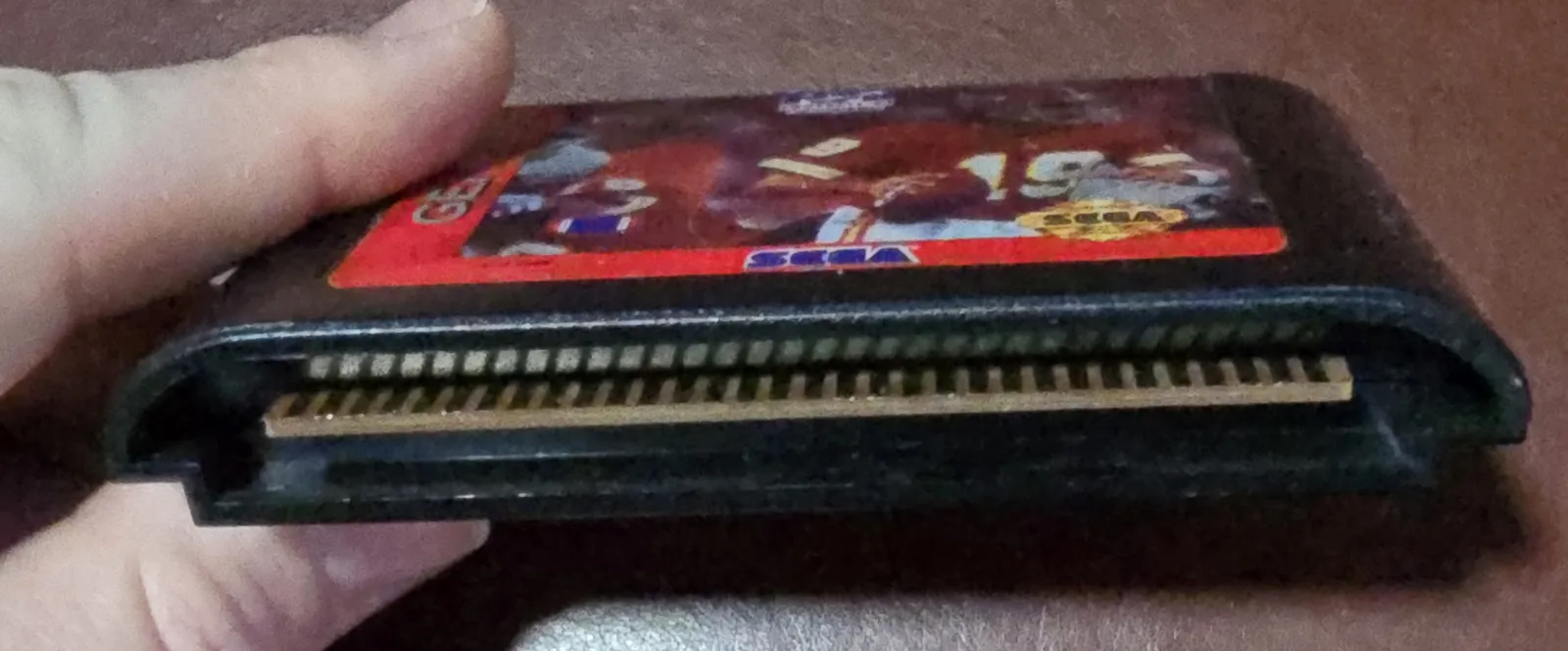 Edge connector of the Genesis cartridge showing the cleaned gold contacts