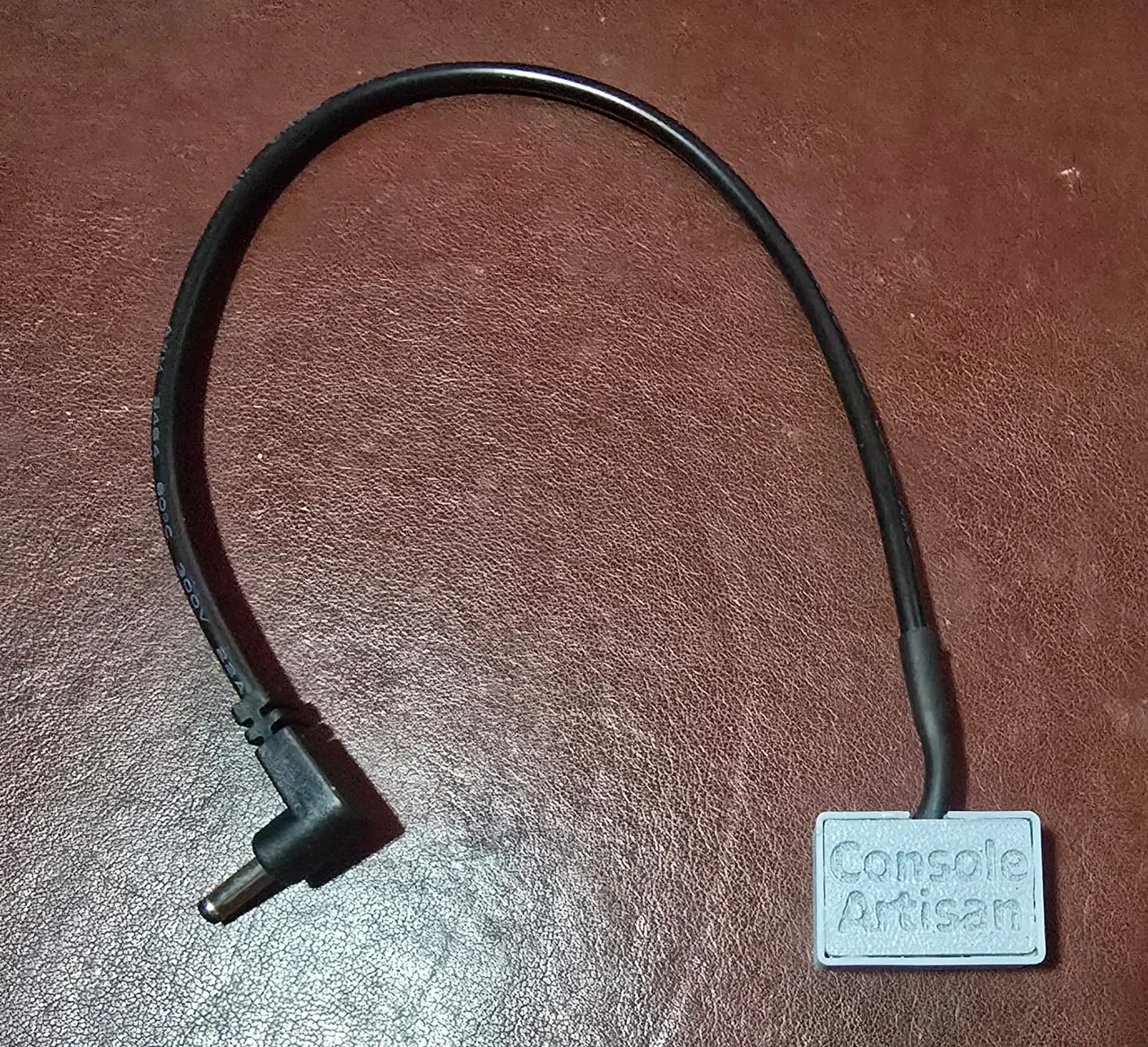 A later-build prototype Nintendo Game Boy DMG power dongle