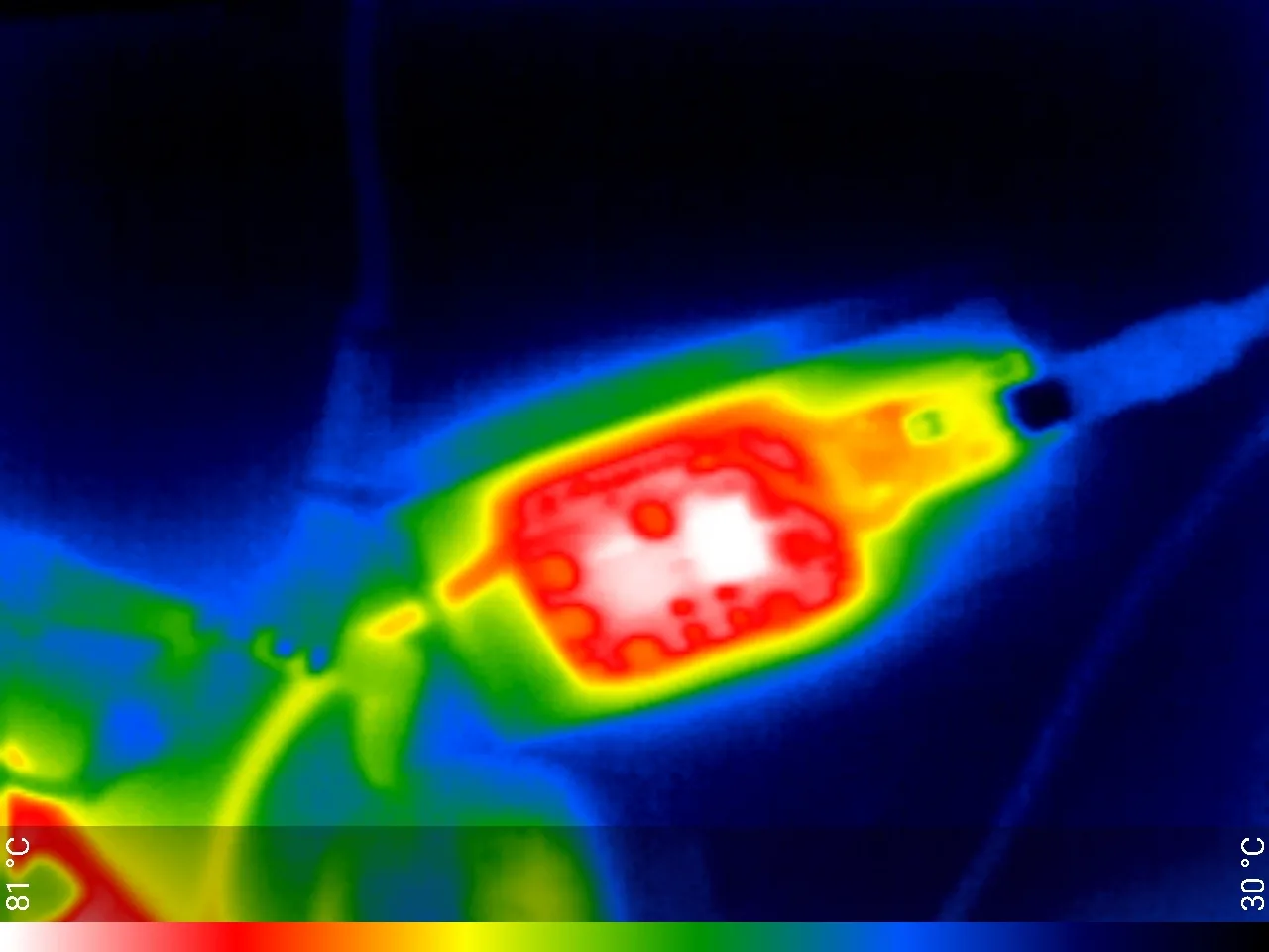 Thermal camera image of the converter board with the case lid removed after a sealed soak, palette spanning 30 to 81 degrees Celsius, with the two inductors showing as the hottest points