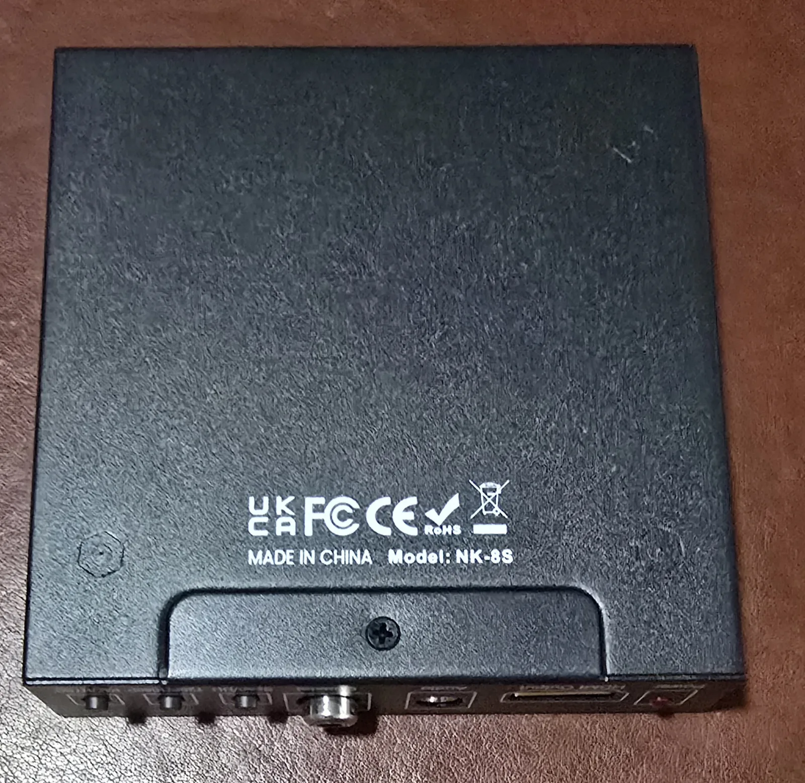Bottom of the converter showing model NK-8S and certification marks