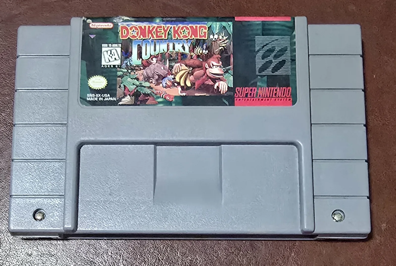 Front of an authentic Super Nintendo Donkey Kong Country cartridge by Rare