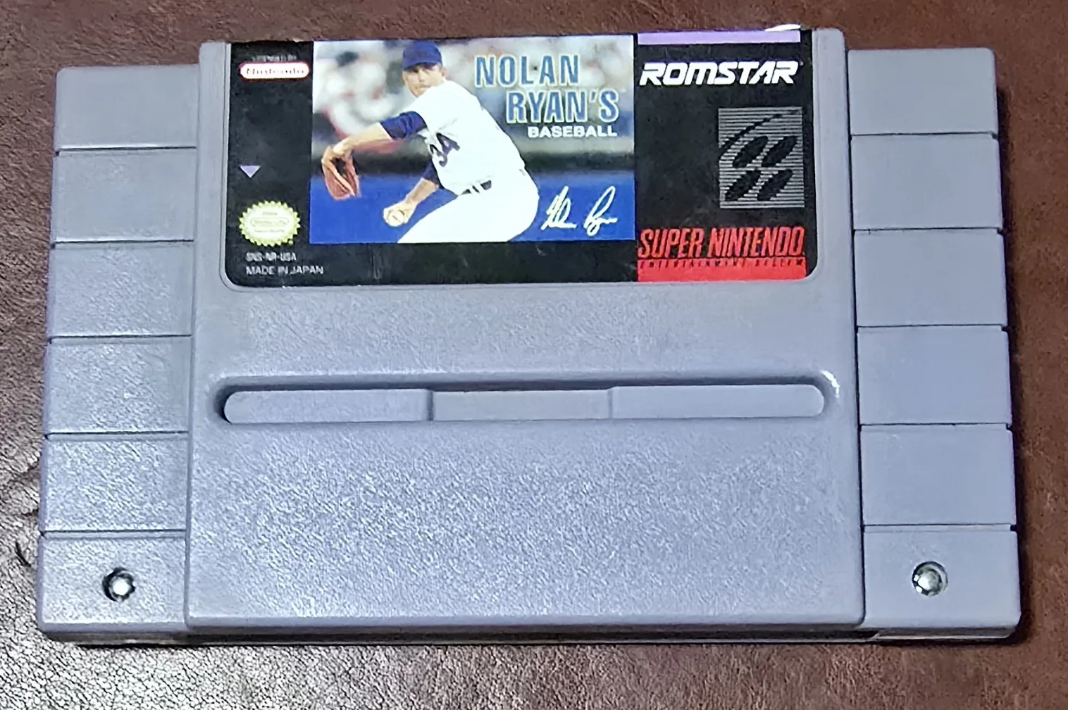 Front of an authentic Super Nintendo Nolan Ryan's Baseball cartridge by Romstar