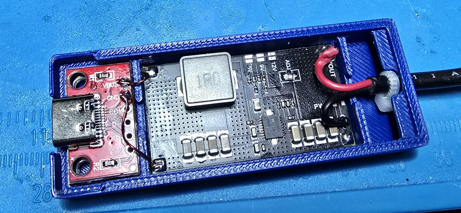 Another interior view of the assembled boost board and USB-C input seated in the printed case