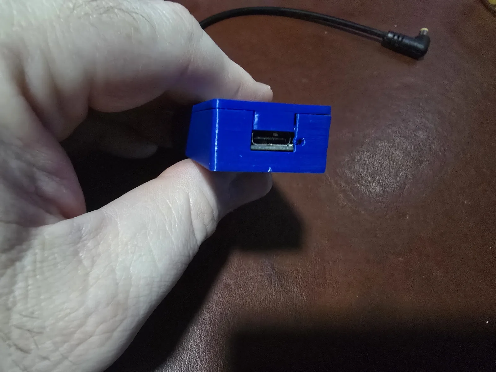 The Lite adapter's USB-C input end with its built-in power LED, unplugged