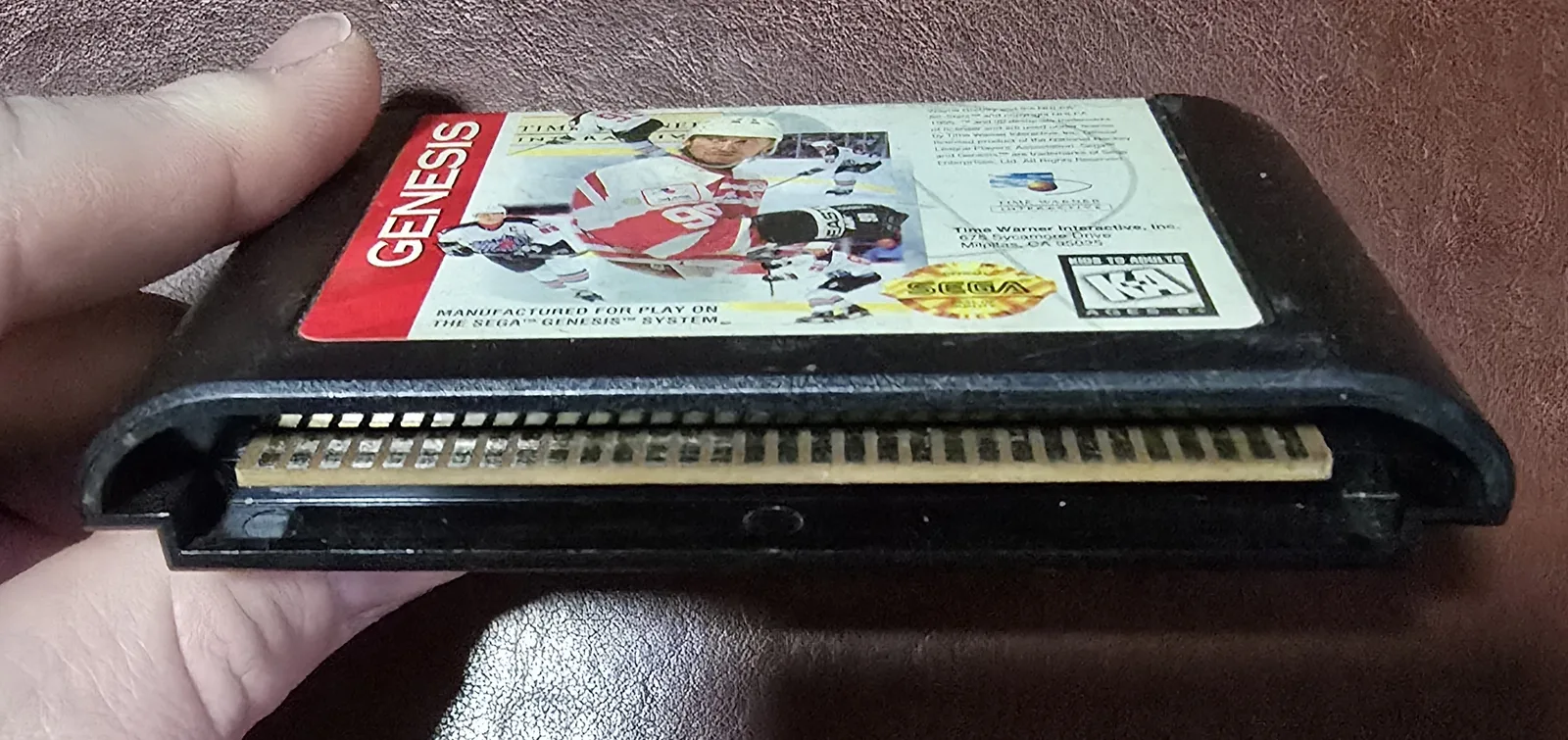 Edge connector of the Genesis cartridge showing the cleaned gold contacts