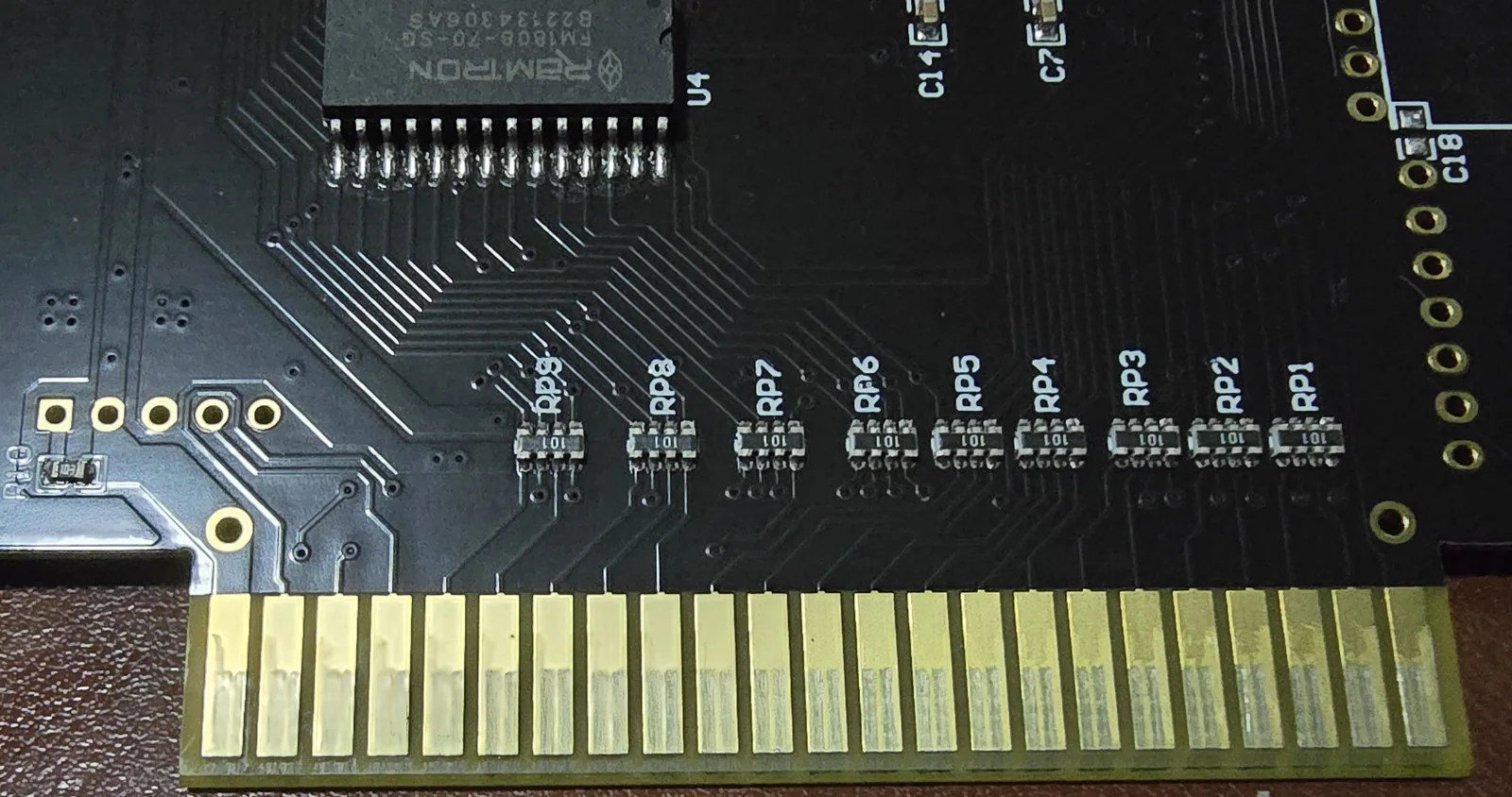 Close-up of the FlashMaster PCB showing nine resistor networks labelled RP1 through RP9 each marked 101, in a row just above the card edge connector, with a Ramtron FM1808-70-SG chip above them.