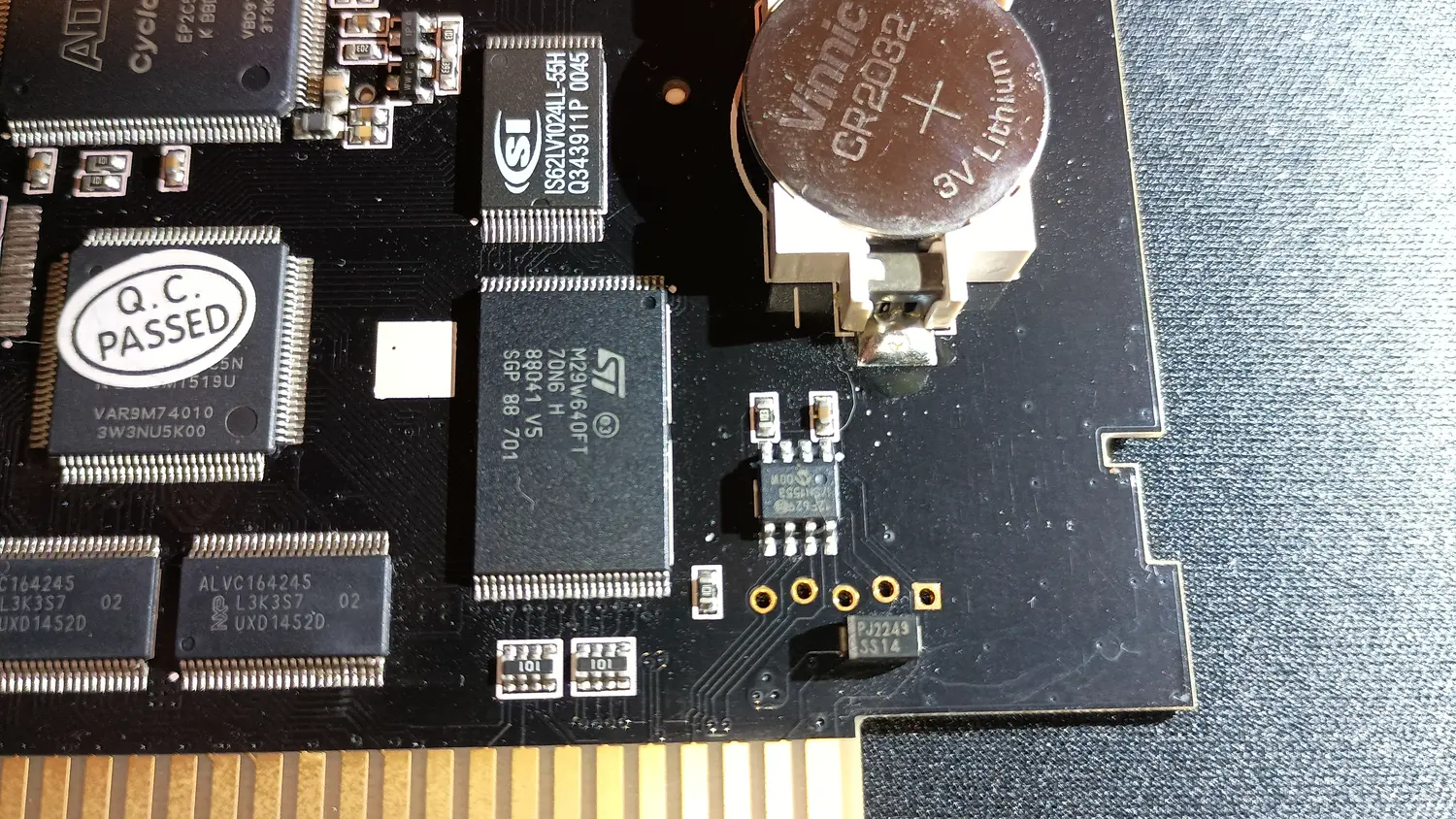 Super EverDrive PCB chip side, showing two 48-pin transceivers marked ALVC164245 L3K3S7 next to an ST M29W640FT flash chip, a Vinnic CR2032 coin cell in a holder, and the card edge connector along the bottom.